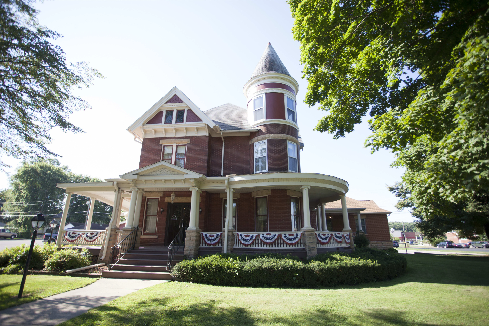 A large brick house with a tower on top of it