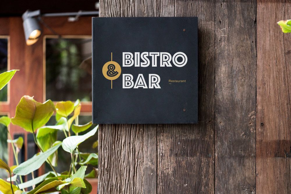 A Black Sign on A Wooden Wall that Says Bistro Bar — Shogun Signs & Print Pty Ltd in Tweed Heads, QLD