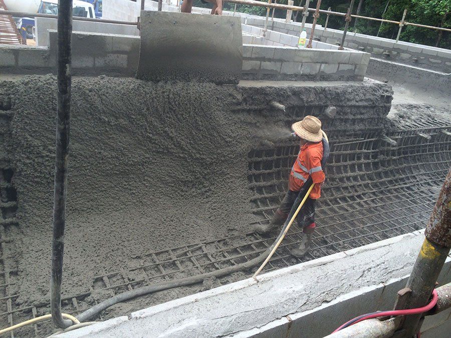 Concrete Getting Poured onto Mesh — Far Northern Concrete Pumping in Mareeba, QLD