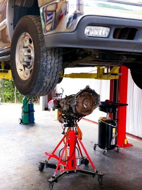 Truck Transmission Being Serviced, Suspended on a Lift | Hwy 59 Auto Repair