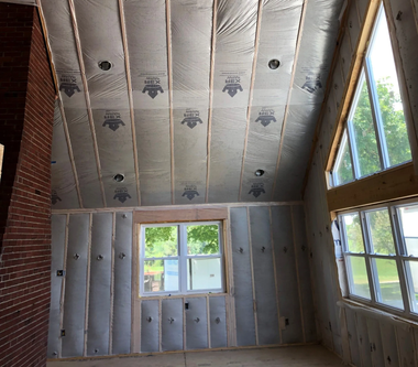 Man Removing Thermal Roof Insulation Layer — Betz Insulation — Schnellville, IN