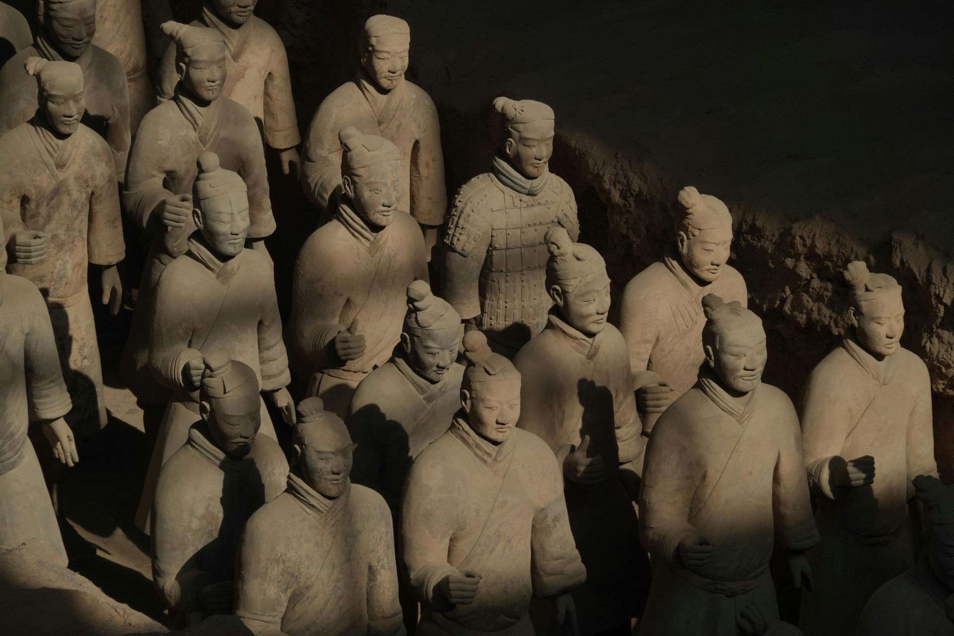 A group of statues are standing next to each other