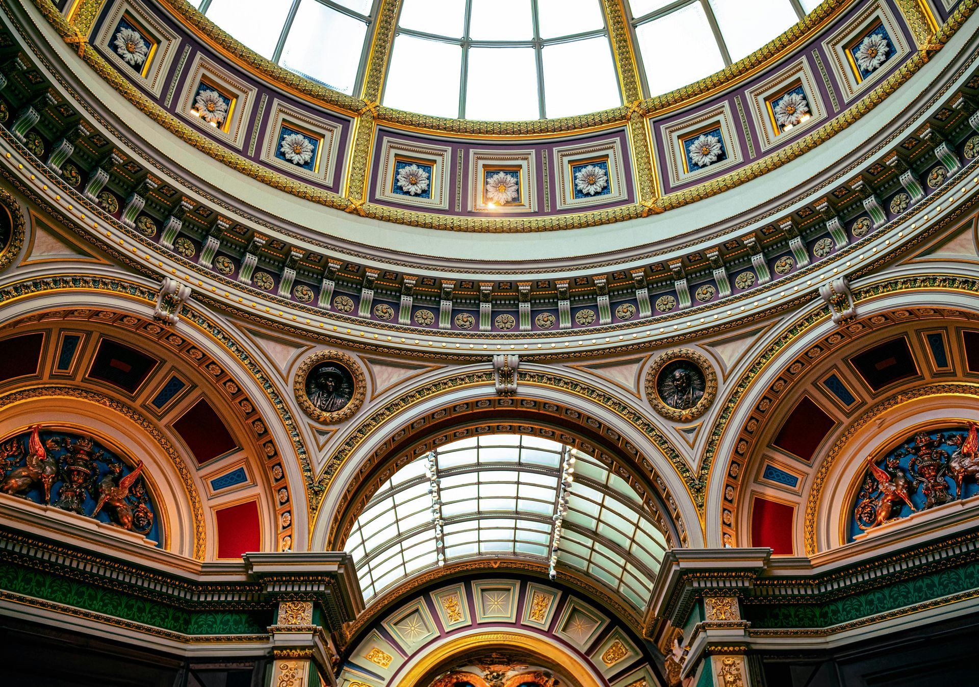 Looking up at the dome of a building with a lot of windows.
