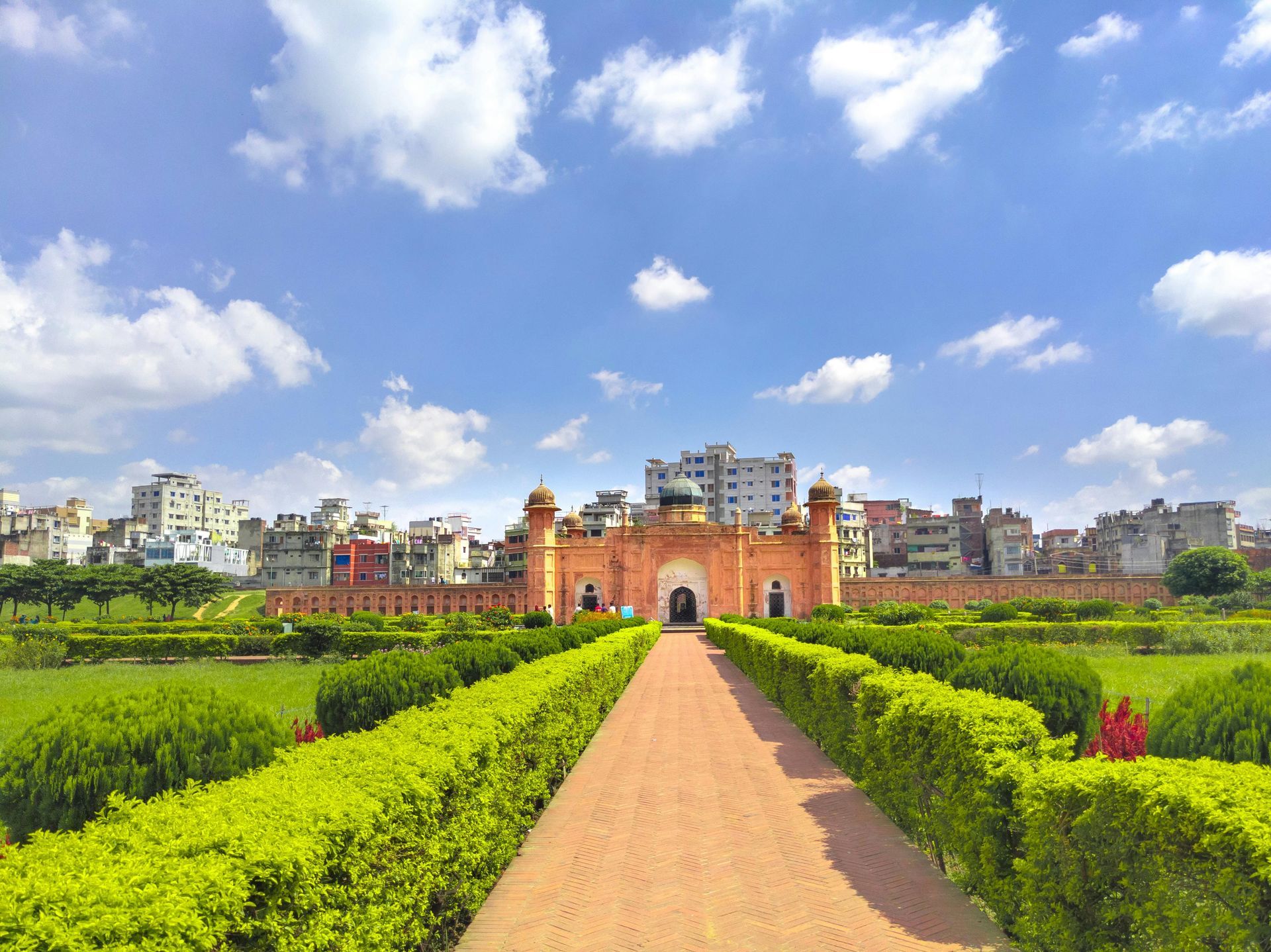 There is a castle in the background and a path leading to it.