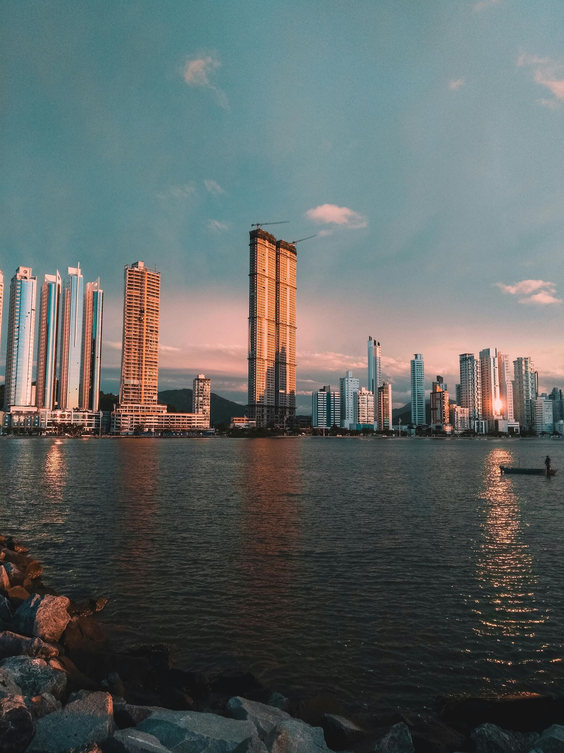 A large body of water with a city skyline in the background