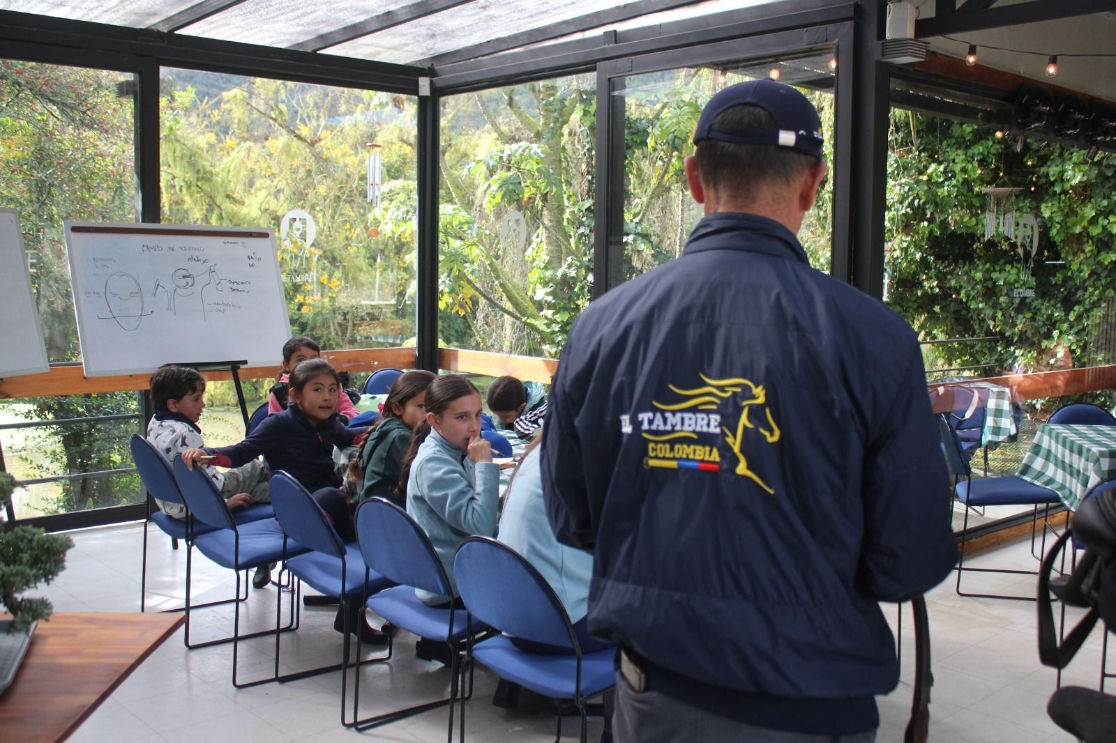 A man wearing a jacket that says 1 tamare on it