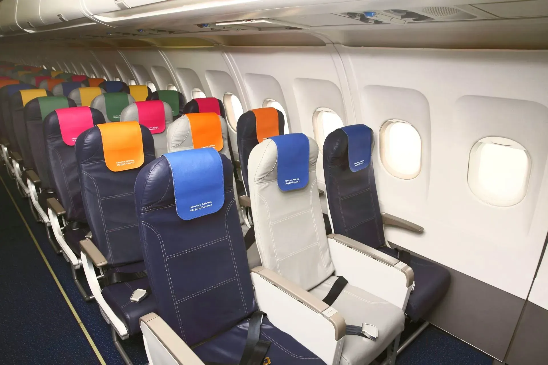 A row of colorful seats on an airplane