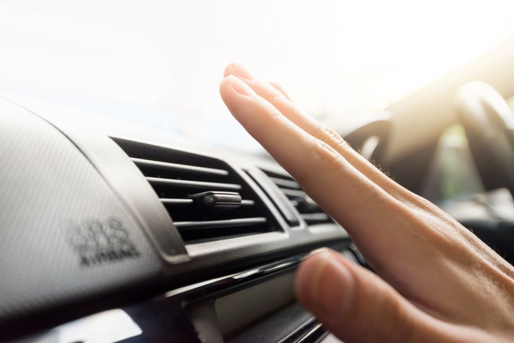 Hand Checking Air Vent Airflow Inside a Car — A.M.D. Automotive Services in Mackay, QLD