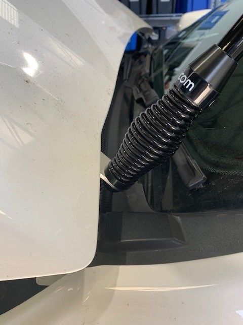 Black Antenna Mounted on a White Car, Near Windshield and Hood — A.M.D. Automotive Services in Mackay, QLD