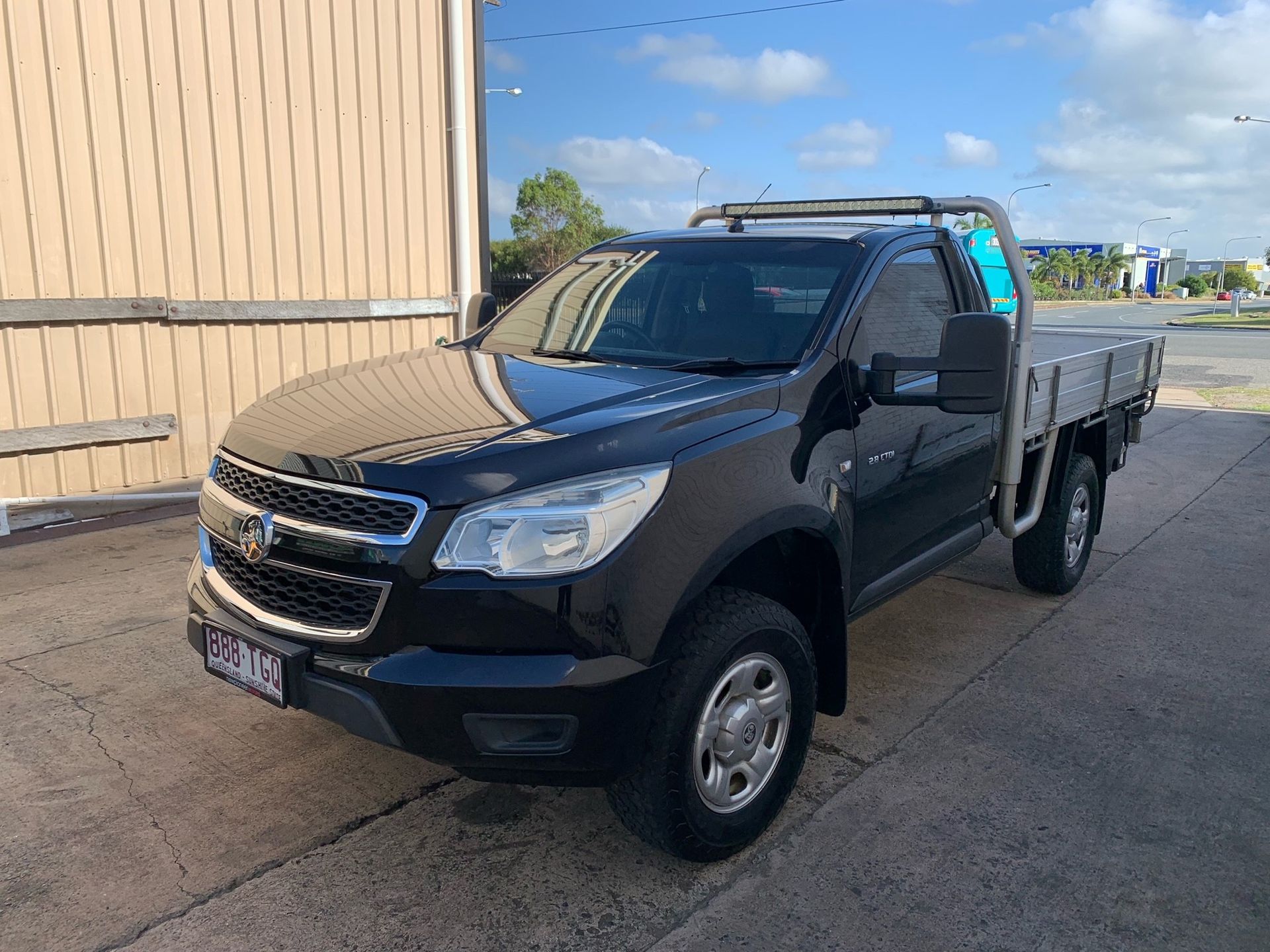 Black Chevrolet Colorado Utility Truck Parked Outside — A.M.D. Automotive Services in Mackay, QLD