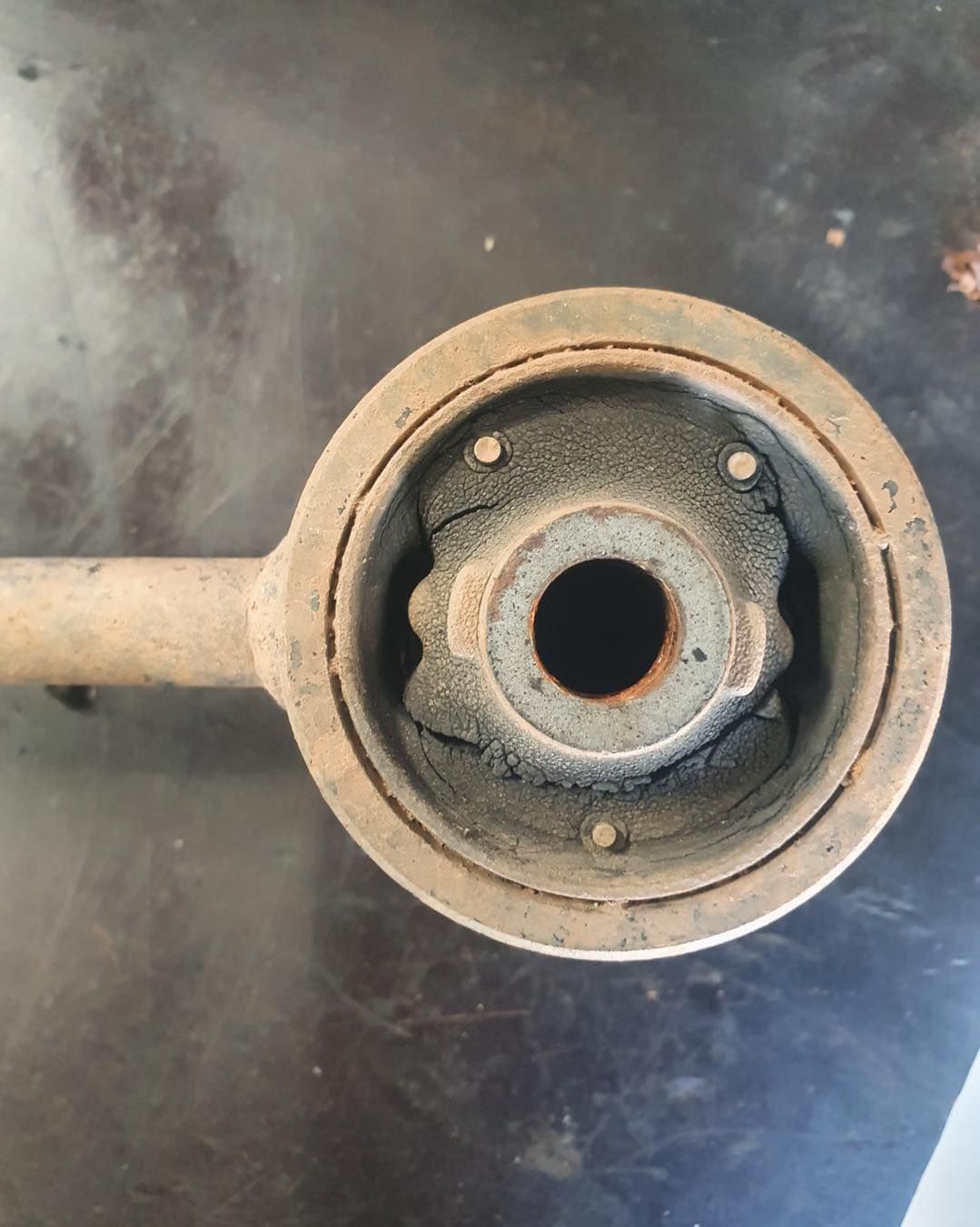 Rusty Suspension Component With a Worn Rubber Bushing — A.M.D. Automotive Services in Bowen, QLD