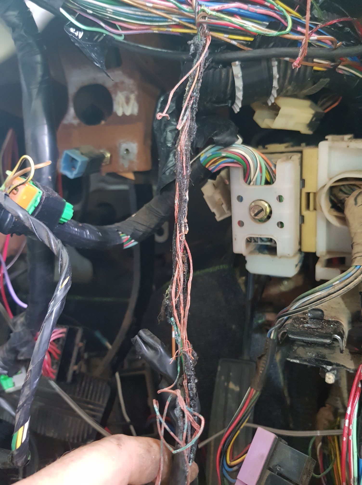 Damaged Car Wiring Harness With Frayed Wires in a Vehicle Dashboard — A.M.D. Automotive Services in Mackay, QLD