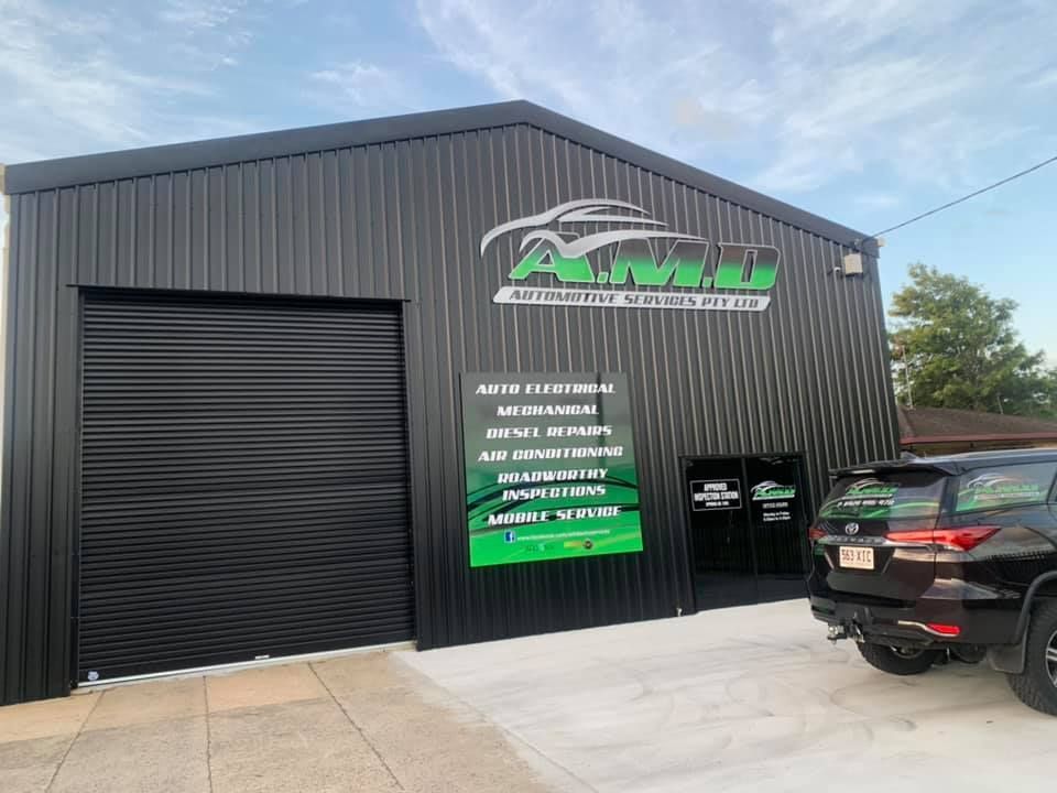 Black Auto Repair Shop With Logo and Services Listed — A.M.D. Automotive Services in Mackay, QLD