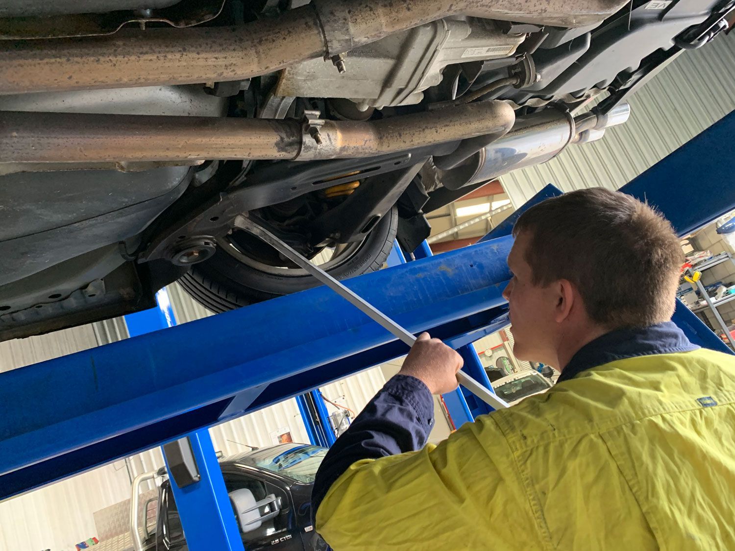 Checking Under A Car For Roadworthy In Mackay