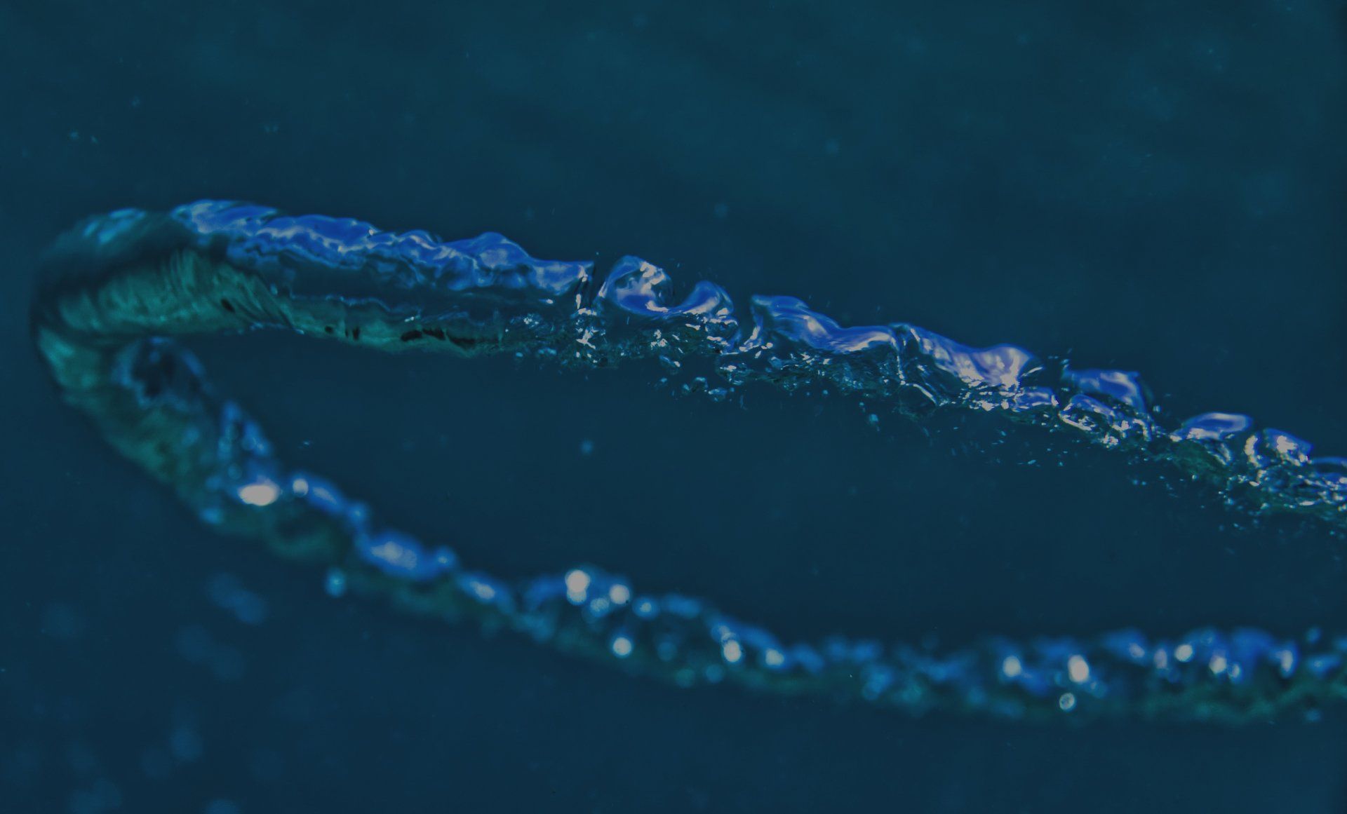 A close up of a blue ring on a blue surface.