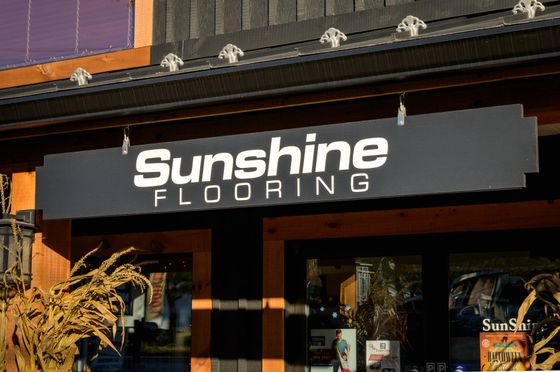 Sunshine Flooring Sign on Building