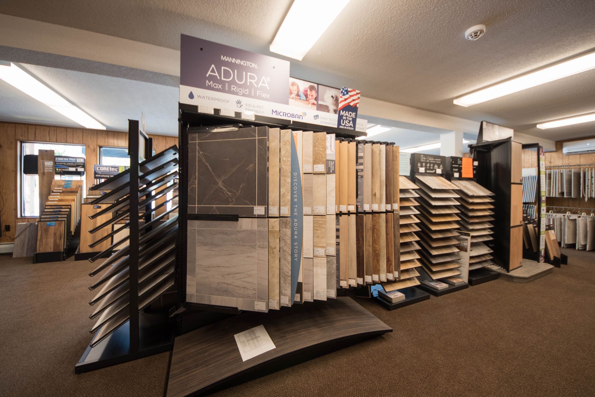 There are many different types of flooring on display in this store.