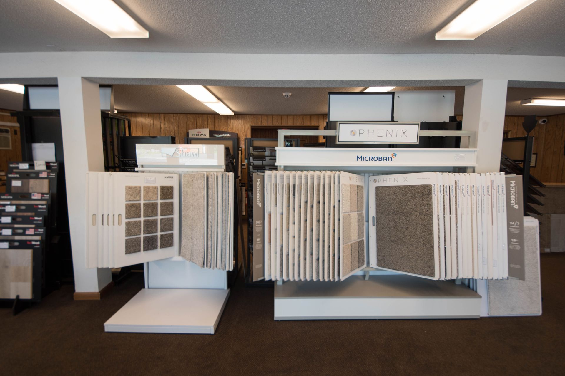 A display of carpets and tiles in a store