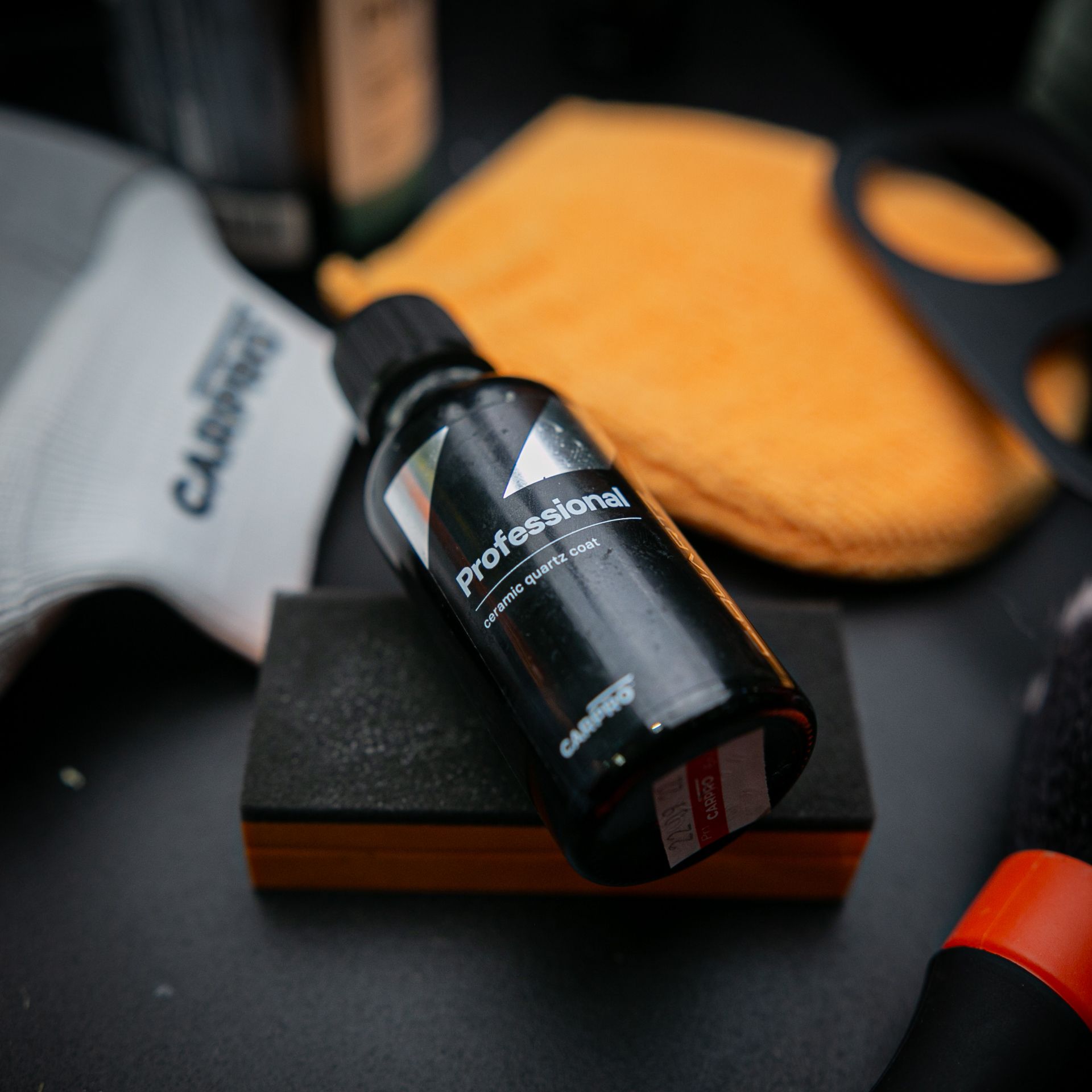 A bottle of professional sitting on a sponge