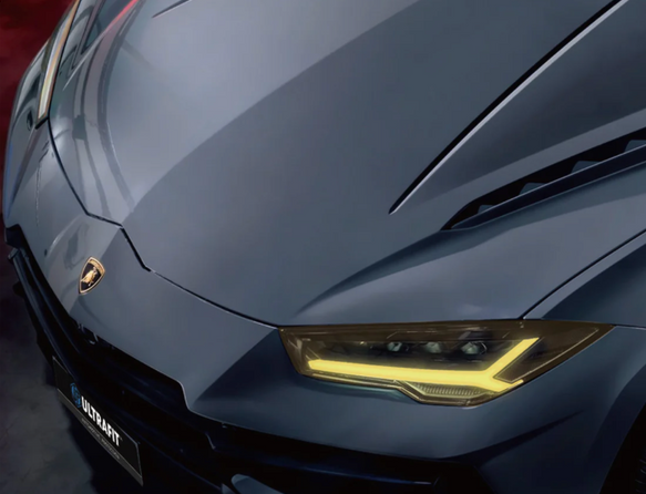 A close-up of a tinted, angular taillight on the white rear fender of a vehicle.