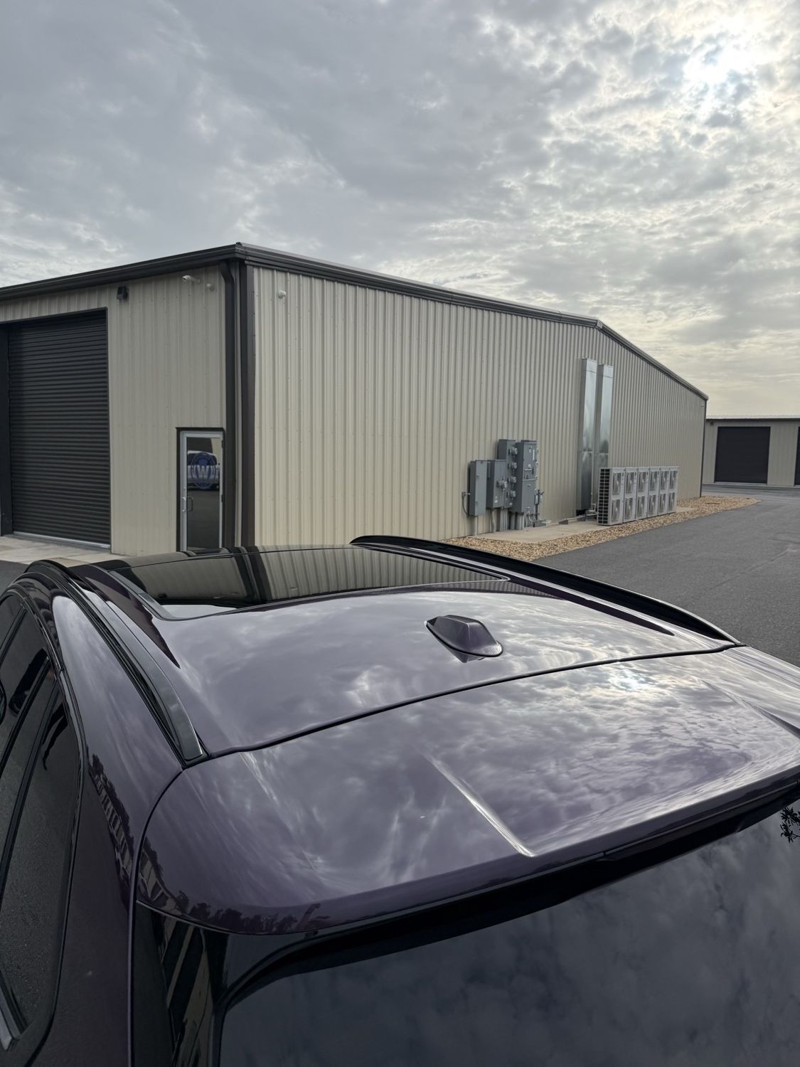Panoramic sunroof of a BMW X5 with ceramic window tint installed in Wildwood FL