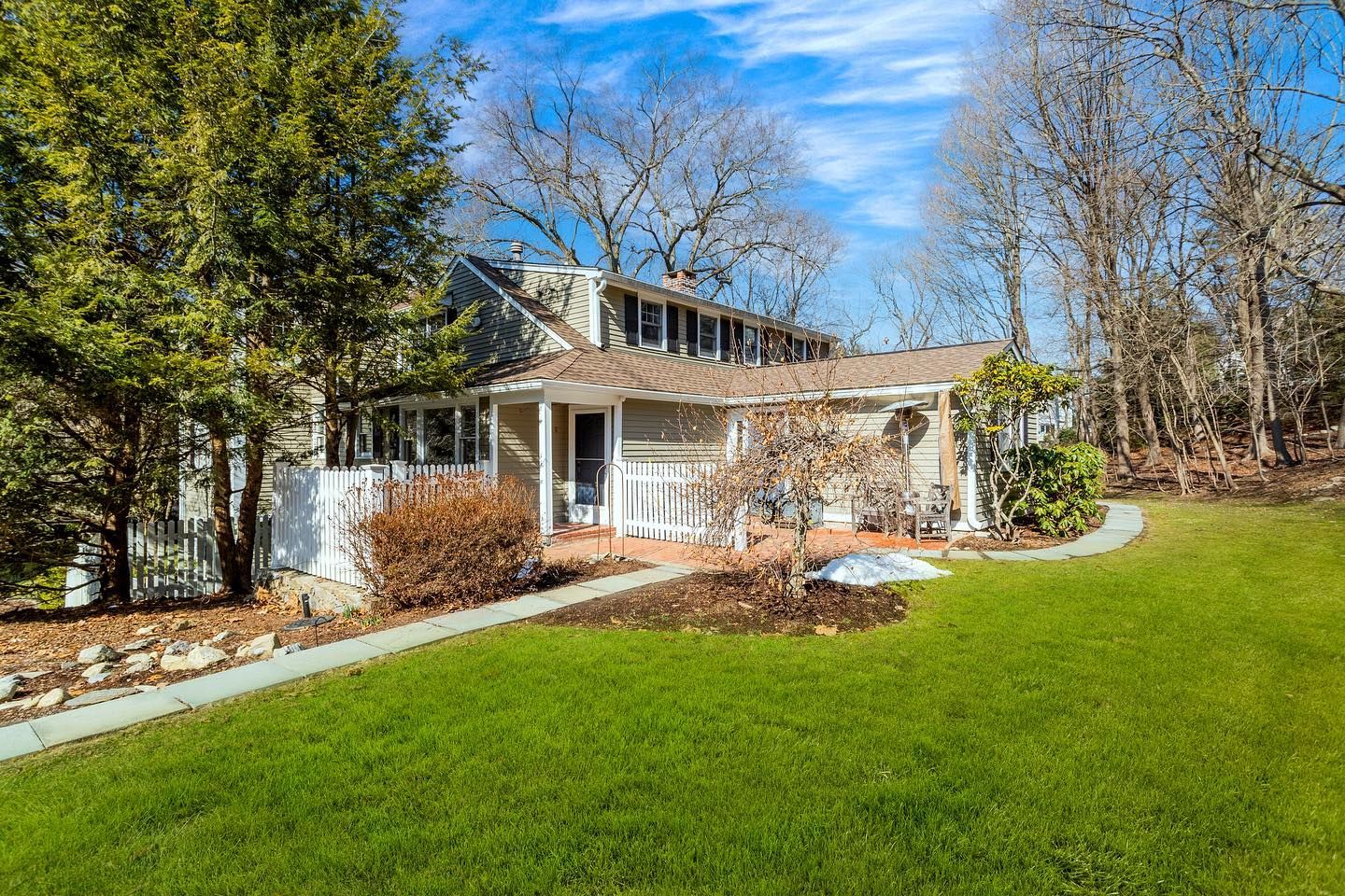 Two people are sitting at a table looking at a floor plan.