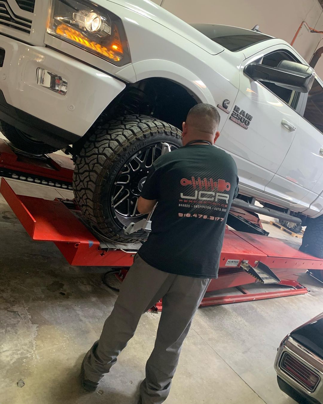JCR Performance team repairing a truck tire - auto repair shop in Sacramento, CA