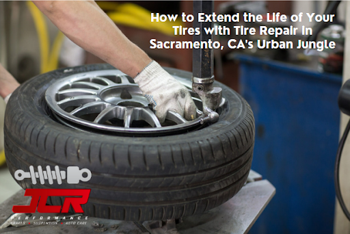 A mechanic using a tire mounting machine to replace a tire on a vehicle rim.