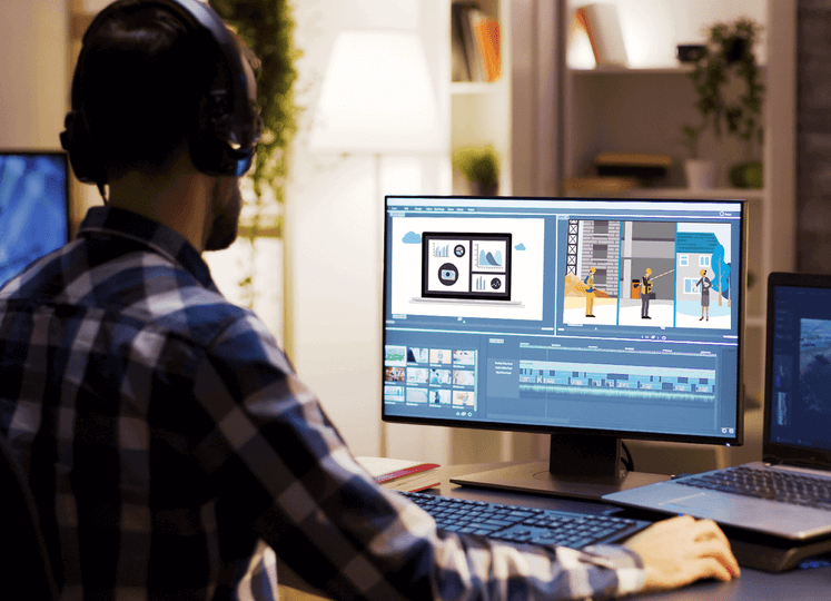 Man Editing Video on a Desktop Computer Editing a Video Using a Video Editing Software