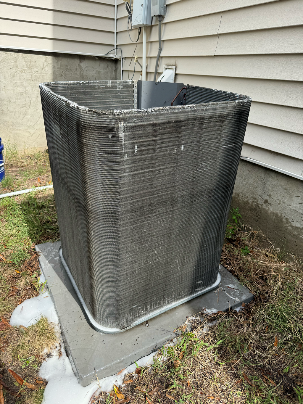 Outdoor air conditioning unit with a clogged fin coil.