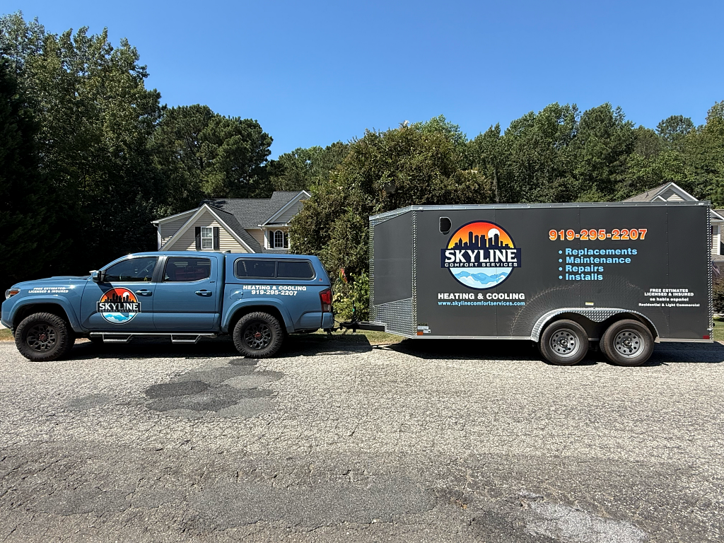 Blue truck towing a trailer with