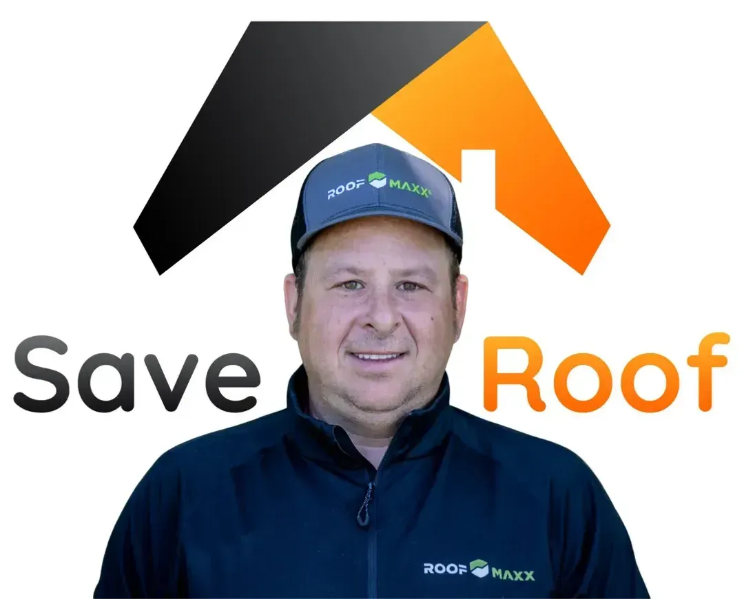 A man wearing a hat and a jacket is standing in front of a save roof logo.