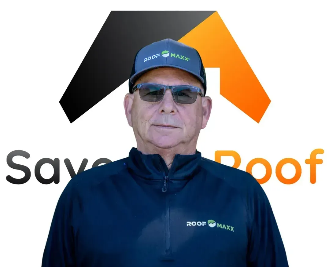 A man wearing a hat and sunglasses is standing in front of a save roof logo.