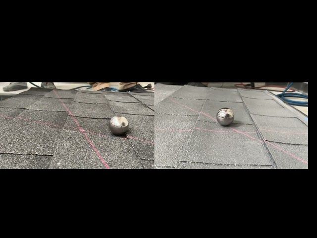 A couple of balls are sitting on top of a roof.