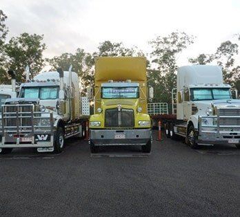Yellow and white trucks — Freight Services in Humpty Doo, NT