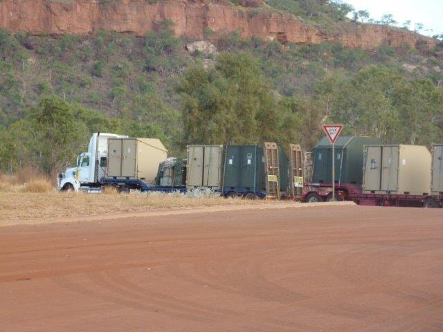 Green and white trucks — Freight Services in Humpty Doo, NT