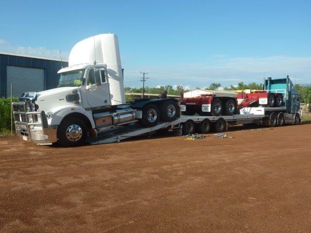 Truck carrying a truck — Freight Services in Humpty Doo, NT