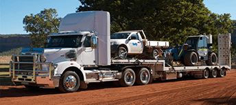 White truck carrying truck — Freight Services in Humpty Doo, NT