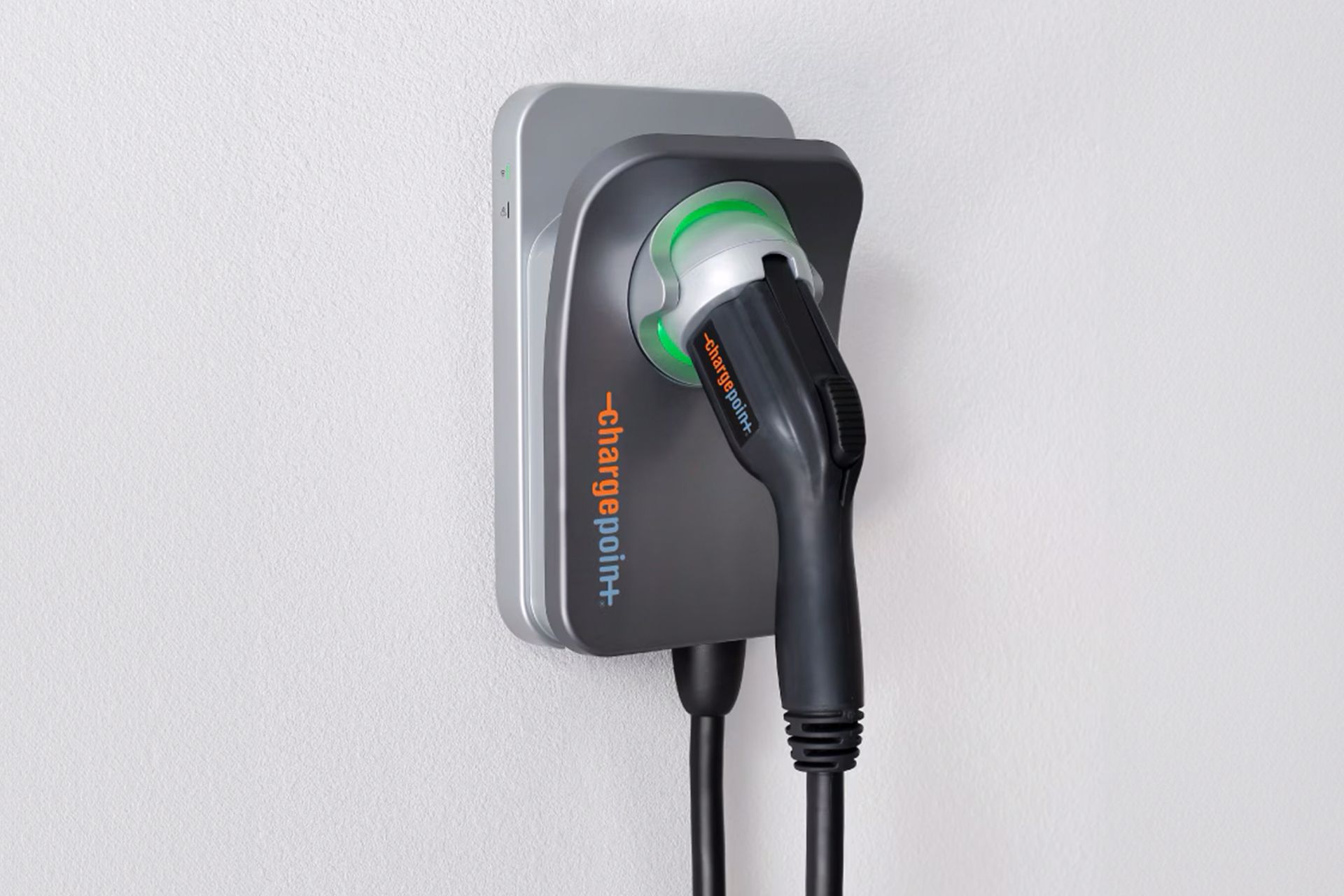 A charger is plugged into a wall socket.