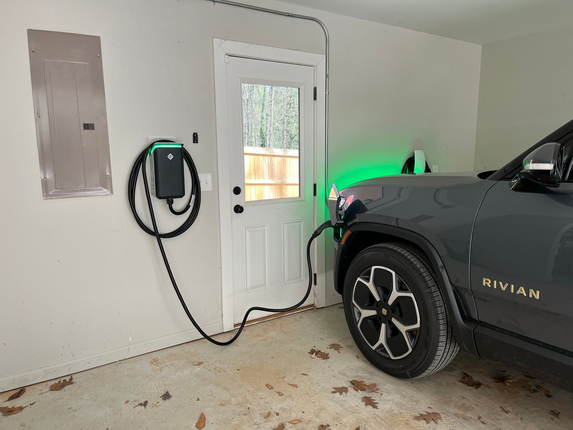 An electric car is being charged in a garage.