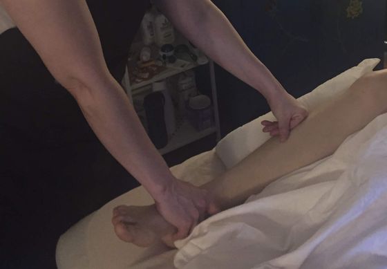 Photo of Shannon giving a therapeutic massage