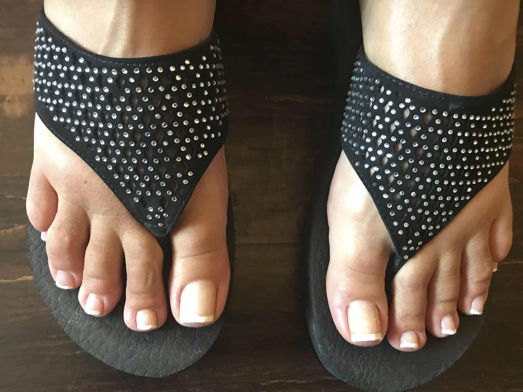 Photo of feet wearing flip flops
