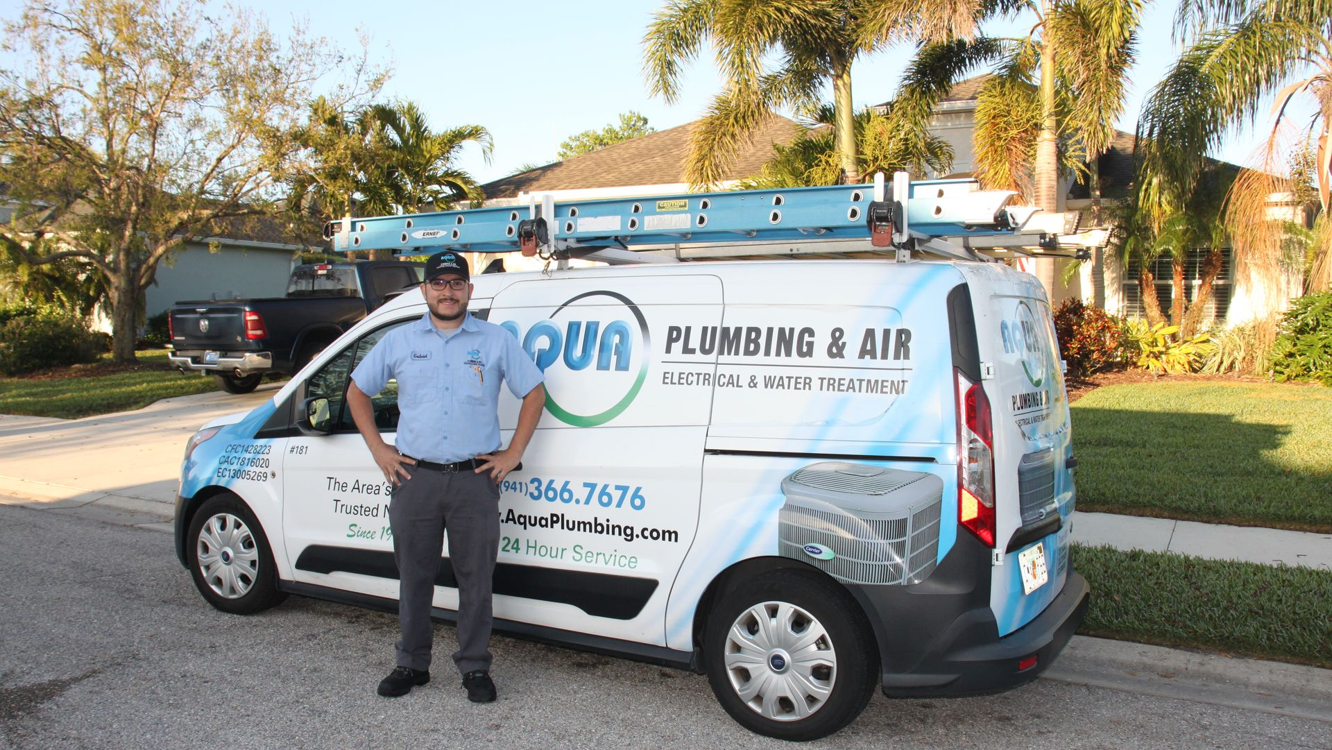 Man standing by a work van with 