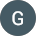 A dark gray circle with the white letter 