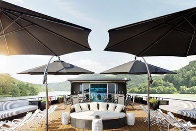 There are a lot of umbrellas on the deck of a boat.