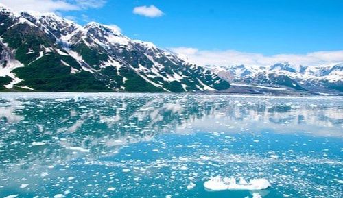 A large body of water with mountains in the background.