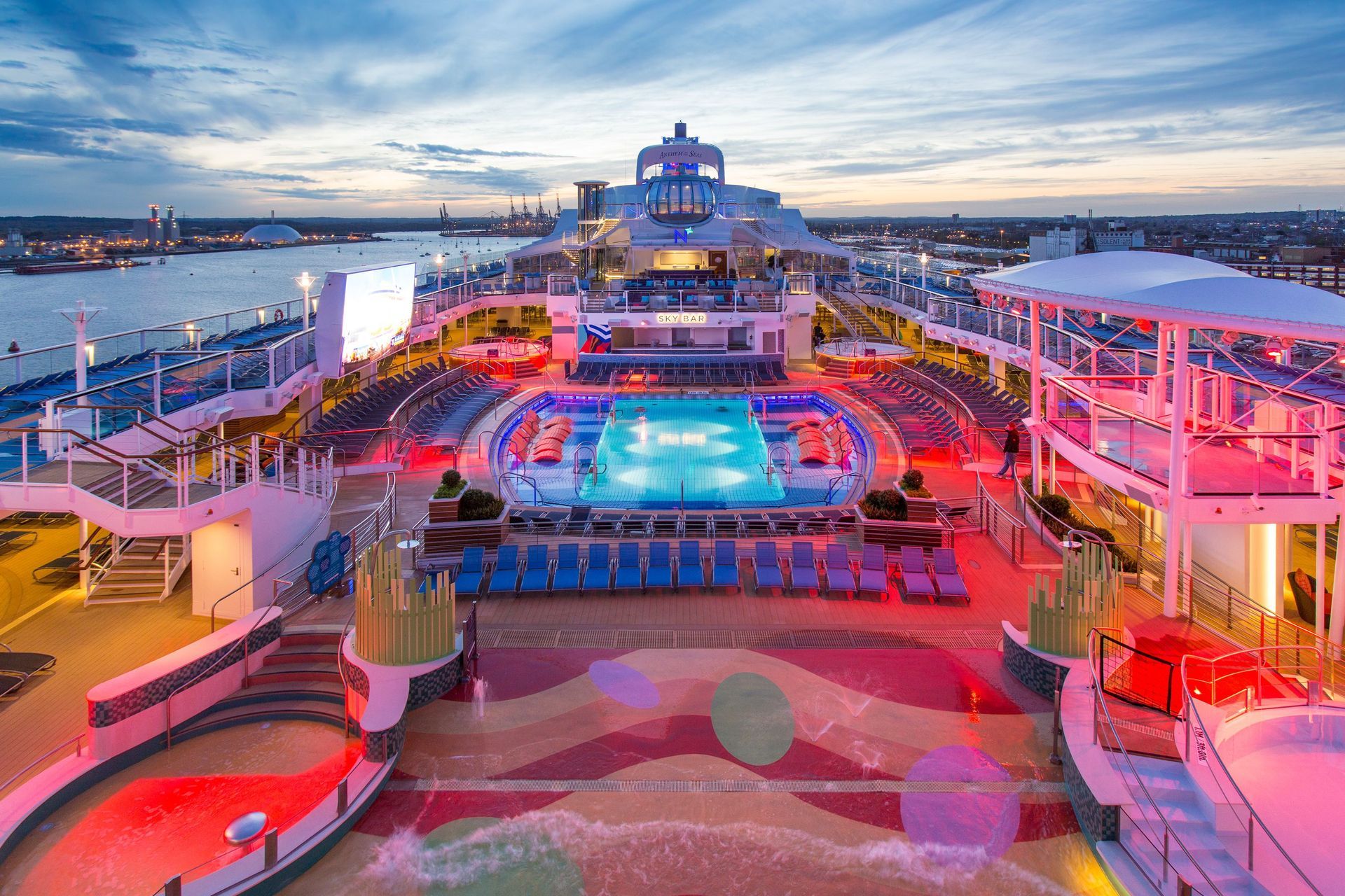 An aerial view of a cruise ship with a large swimming pool.