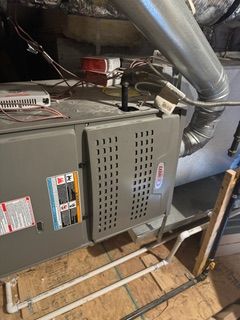 A close up of a person holding a digital clamp meter