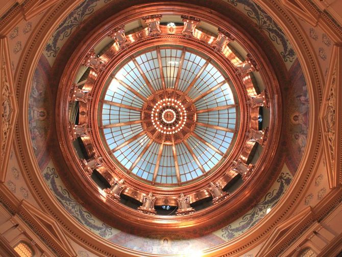 Looking up at a dome with a circle in the middle