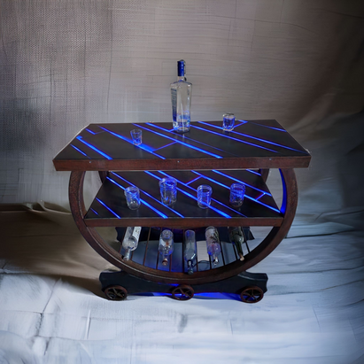 A table with a bottle of vodka and shot glasses on it